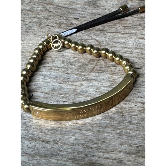 Michael Kors Jewelry - Michael Kors Bracelet Gold Tone Beaded With Engraved Bar And Adjustable Cord